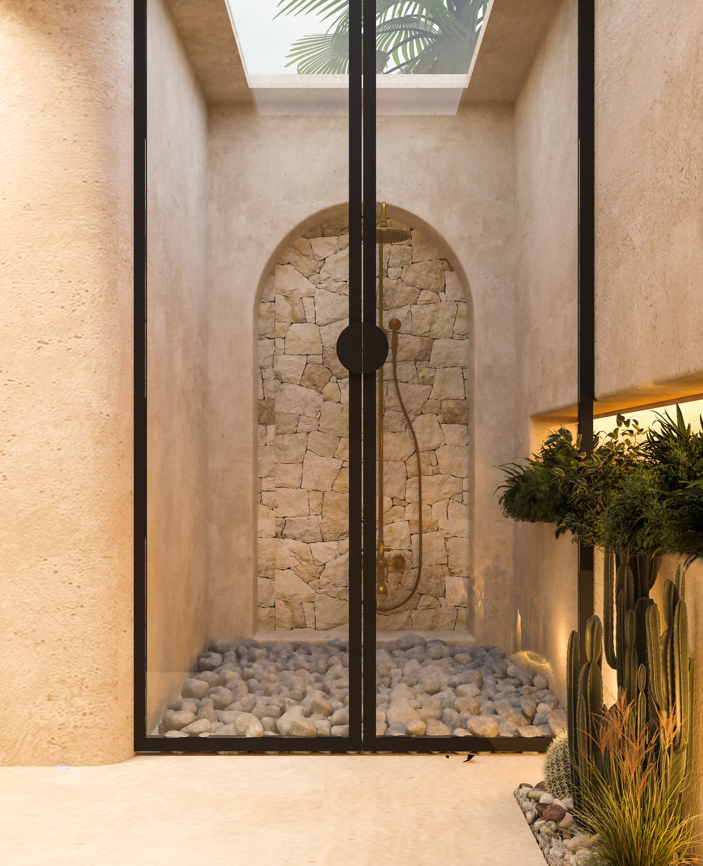 A shower design with a stone wall, pebble surface and overhead daylight